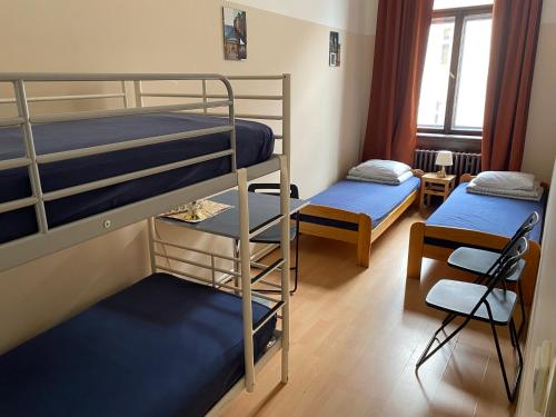 Una cama o camas en una habitación de Hostel EMMA