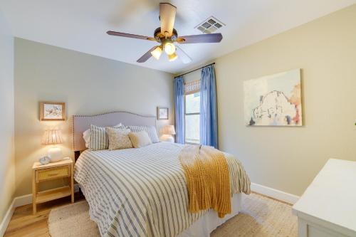 a bedroom with a bed and a ceiling fan at Near Hiking and Golfing Phoenix Home with Pool! in Phoenix