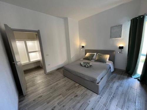Postel nebo postele na pokoji v ubytování Rooms Via XX Settembre