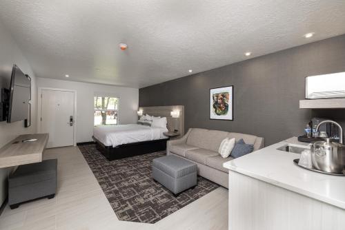 a living room with a couch and a bed at Montclair at Zion in Springdale