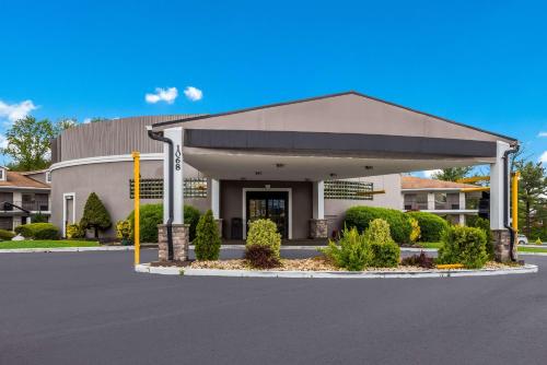 a front view of a building with a parking lot at Best Western Bordentown Inn in Bordentown