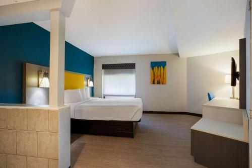 a hotel room with a bed and a sink at Best Western Bordentown Inn in Bordentown