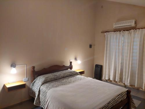 Ένα ή περισσότερα κρεβάτια σε δωμάτιο στο Casa Cone