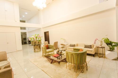 a large living room with couches and chairs at Accra Luxury Apartments @ The Signature in Accra