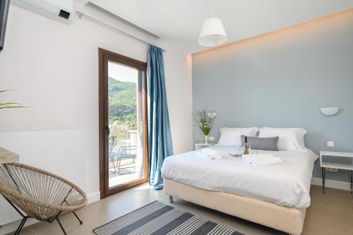Säng eller sängar i ett rum på Villa Scorpios
