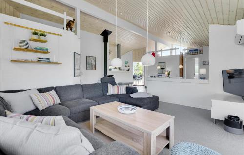 a living room with a couch and a table at Nice Home In Ejstrupholm With Kitchen in Ejstrup