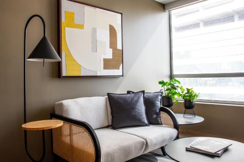a living room with a couch and a table at New Modern Apartment in Polanco in Mexico City
