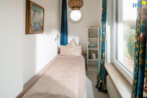 Postel nebo postele na pokoji v ubytování Villa Düna Ferienwohnung 5