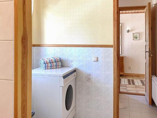 a laundry room with a washing machine in a bathroom at 5 person holiday home in STILLINGSÖN-By Traum in Stillingsön