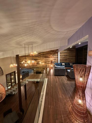 a living room with a couch and a table at NATIVA MOUNTAIN SUITES in Curacautín