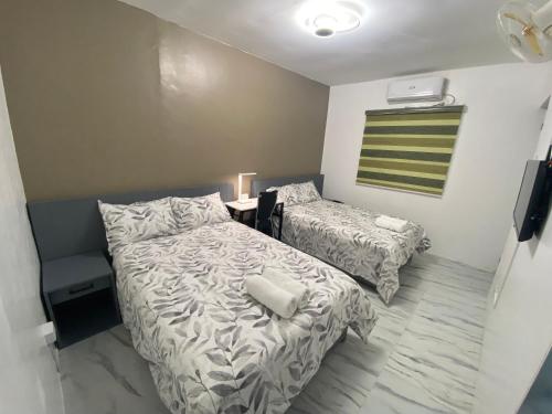 מיטה או מיטות בחדר ב-Feel at Home at Capas 2BR 2BA House