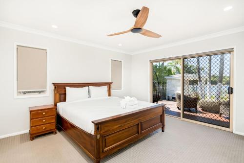 a bedroom with a bed and a large window at Panarama Waterview! Waterfront Luxury Holiday Heave in GC in Gold Coast