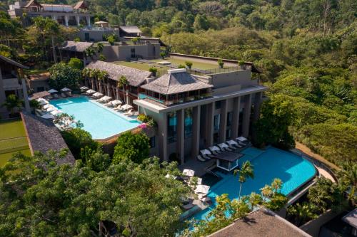 an aerial view of a mansion with a swimming pool at Avista Hideaway Phuket Patong - MGallery in Patong Beach