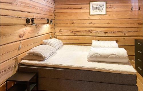 a sauna with two pillows sitting on top of it at Beautiful Home In stby With Sauna And 4 Bedrooms in Østby