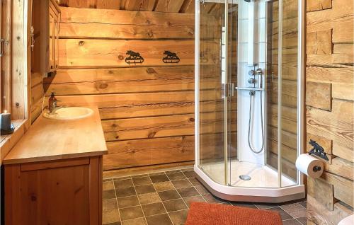 a bathroom with a shower and a sink at Beautiful Home In stby With Sauna And 4 Bedrooms in Østby