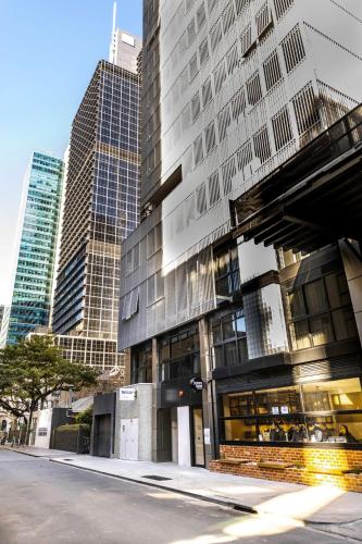 a tall building in a city with tall buildings at Brady Hotels Jones Lane in Melbourne