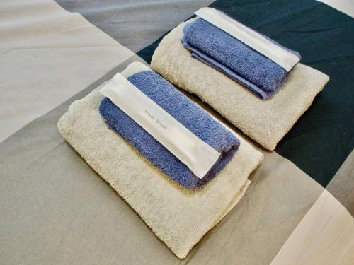 two towels sitting on top of a table at May2023 New Open! The Hotel SPACE 下北沢 in Tokyo