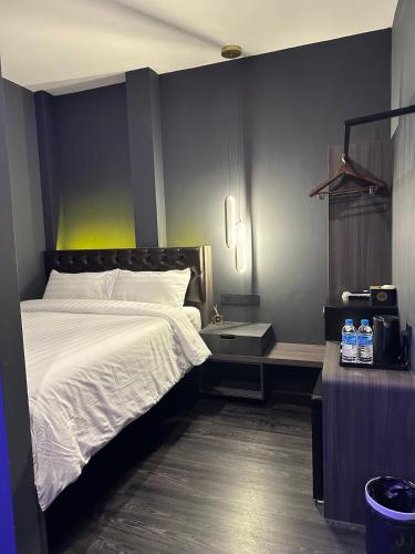 a bedroom with a large white bed in it at HOTEL JJH - newly opened near BUGIS in Singapore