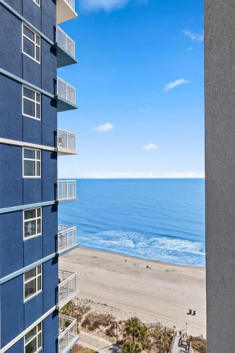 a view of the beach from the balcony of a building at The Grand Myrtle BAY VIEW 1503 Full New Remodel in Myrtle Beach