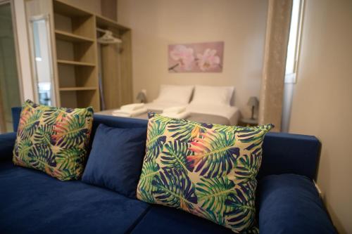 En eller flere senge i et værelse på Amaryllis Maison Emporiou