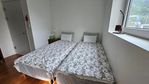 Postel nebo postele na pokoji v ubytování Guesthouse The Kims