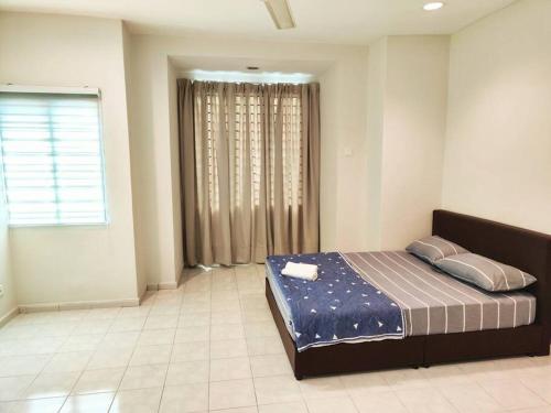 a bedroom with a bed and a large window at Puchong Landed Homestay - 2nd unit @ BKT Puchong in Puchong