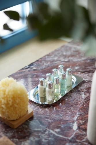 a tray of miniature candles on a table at Orloff Legacy Suites Hydra in Hydra