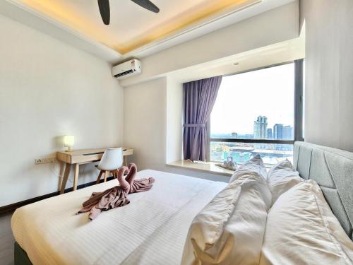 a bedroom with a large bed with a large window at R&F Princess Cove CIQ Premium Sea View Suites by NEO in Johor Bahru