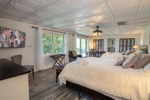 a bedroom with a large bed with a coffered ceiling at Eagles Nest on Seven Devils in Seven Devils