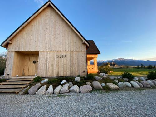 a barn with a sign on the side of it at SOPA Zakopane in Zakopane