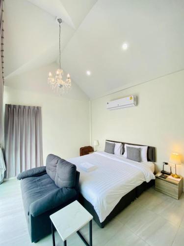Letto o letti in una camera di La Maison Blanche Chiang Rai Resort