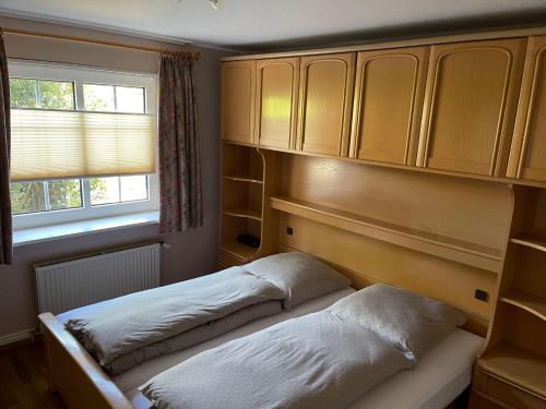 Postel nebo postele na pokoji v ubytování Friesenhaus-Maren-Sterntaucher