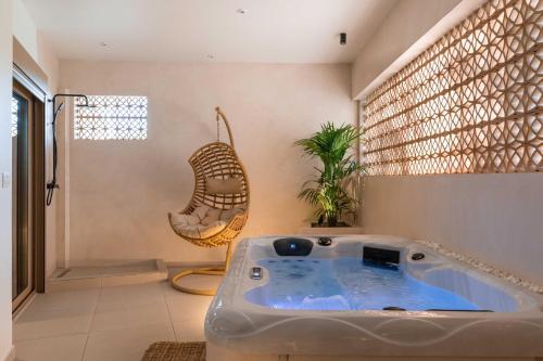 a bathroom with a jacuzzi tub in a room at Mariann Premium Suites in Lardos