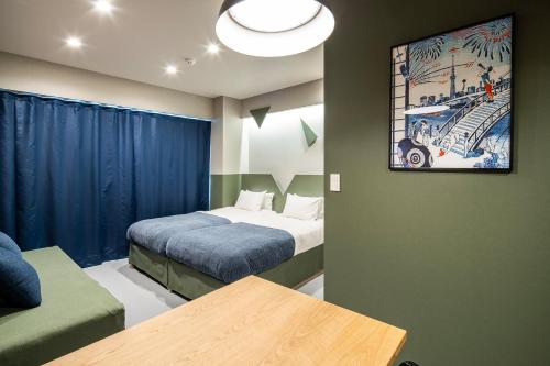 Postel nebo postele na pokoji v ubytování Section L Kuramae - Asakusa