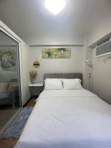 Ένα ή περισσότερα κρεβάτια σε δωμάτιο στο Verdon Parc Condominium