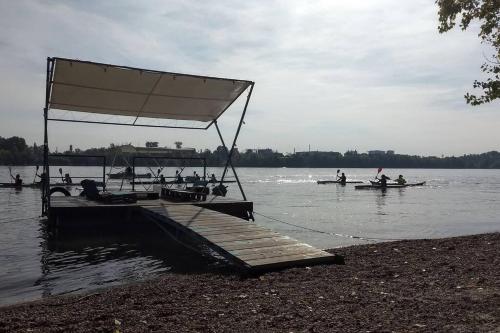 a group of people in boats on a lake at Sziget festival Apartment next to the river in Budapest