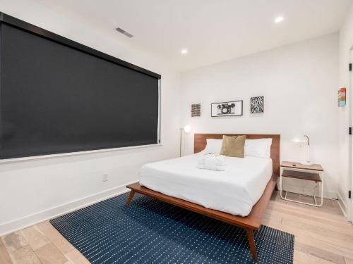 a bedroom with a large blackboard on the wall at Historic German Village Industrial Masterpiece in Columbus