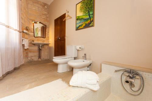 a bathroom with a white toilet and a sink at Casa Mitja a little paradise free wifi in Ses Salines