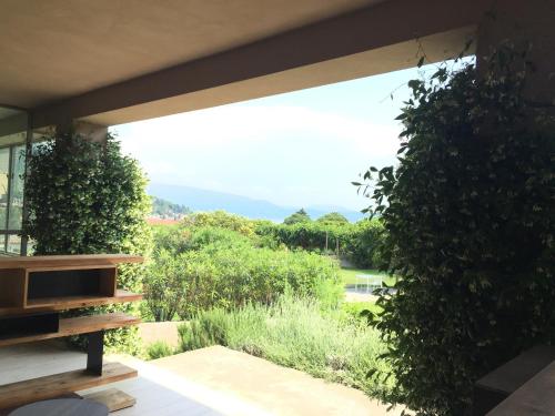 a view from the porch of a house with plants at B&B Panorama Cinque in Salò