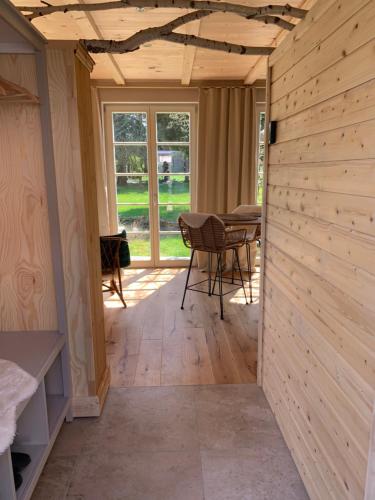 a room in a house with a wooden wall at Idyllische Fewo Belling Spa - eigene Sauna und E-Ladesäule in Dresden