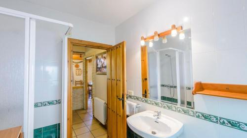 a bathroom with a sink and a mirror at El Rincón de La Iruela by Ruralidays in La Iruela