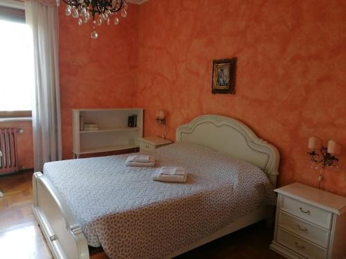 a bedroom with a bed with two towels on it at Alloggio Margherita in Turin