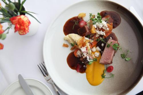 a white plate of food on a table at Hotel Selfoss in Selfoss