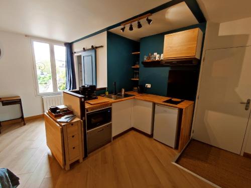 Кухня или мини-кухня в Appartement du pont St Etienne
