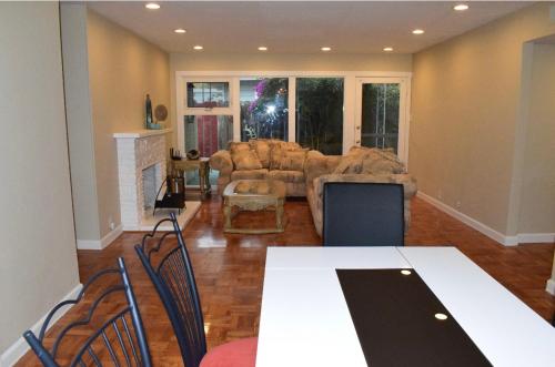 a living room with a couch and a table and chairs at Palo Alto 1Bedroom/2 Baths Near Stanford in Palo Alto