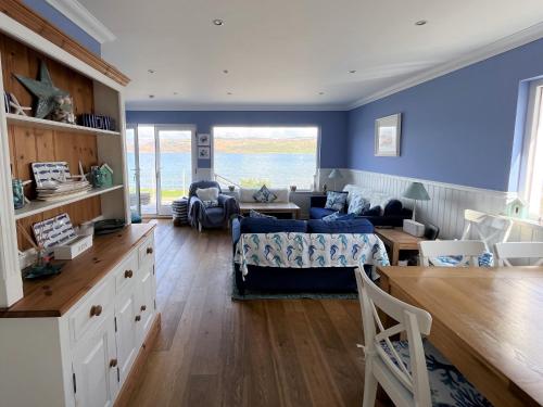 a living room with a bed and a couch at Craignethan in Kames