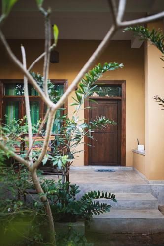 a front door of a house with plants at Beach View in Arugam Bay