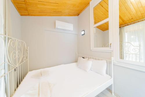 En eller flere senge i et værelse på Convenient and Scenic Flat in Antalya