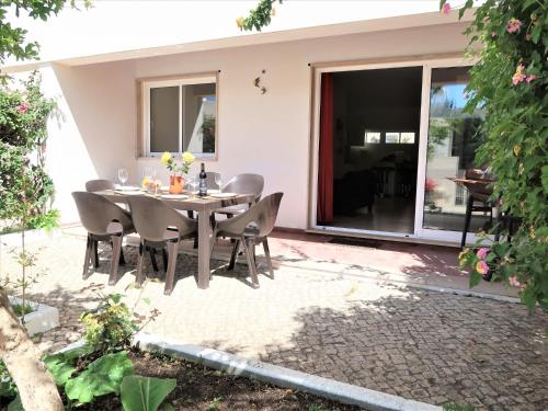 a dining room table and chairs on a patio at Apartment Roy's place by Interhome in Portimão