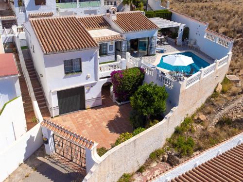 an aerial view of a house with a swimming pool at Villa Las Brisas by Interhome in Nerja